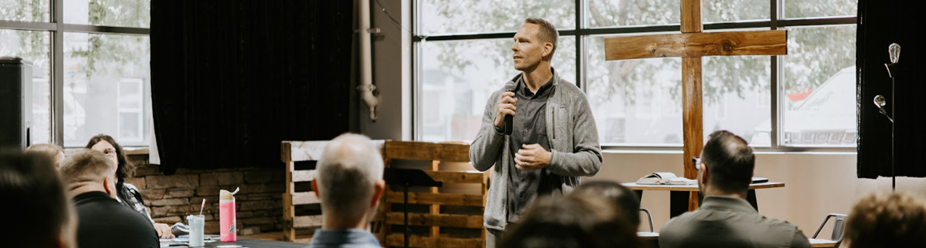 A speaker leading a practical training gathering